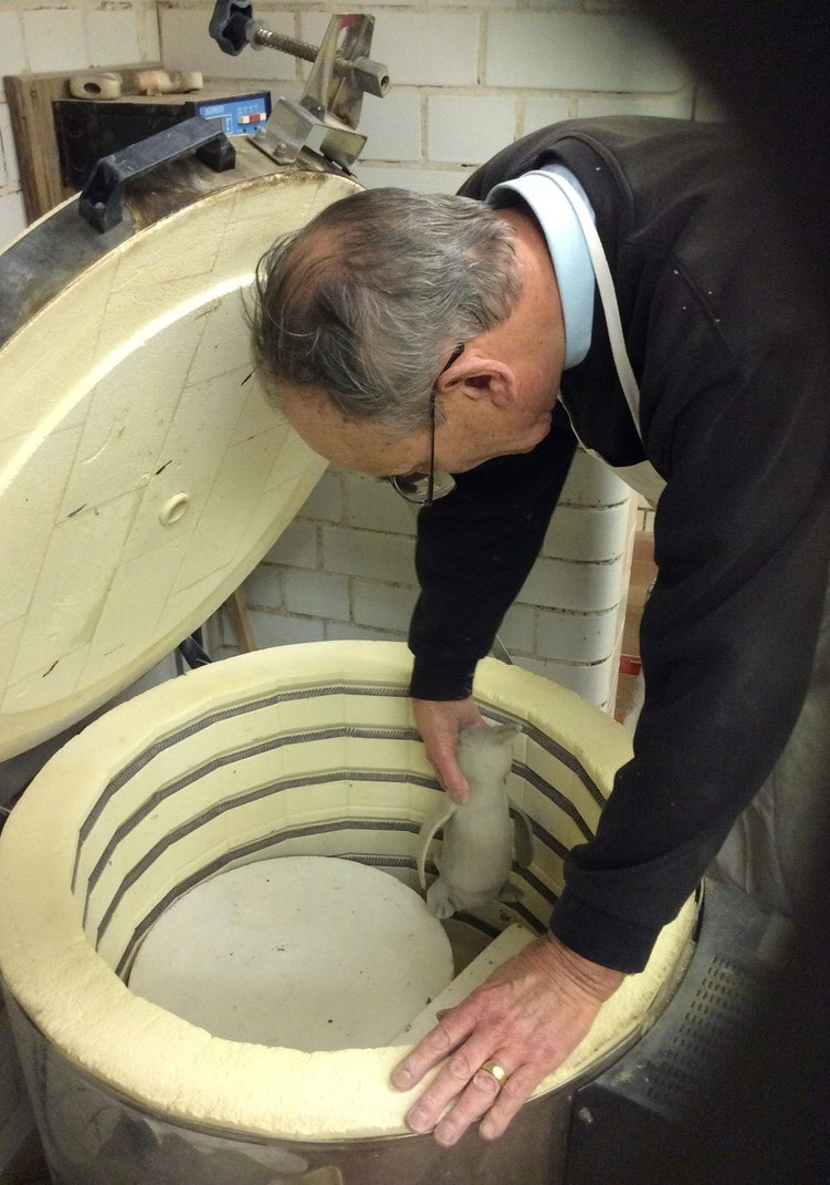 Packing the kiln in the Yate and Sodbury Art and Craft Group pottery